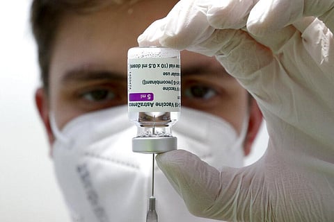 A medical staff prepares a syringe from a vial of the AstraZeneca coronavirus vaccine (Photo | AP)