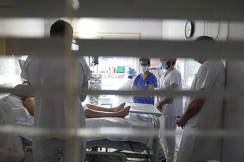 Medical staff meets in a room of a patient affected by COVID-19 virus in the ICU unit at the Ambroise Pare clinic in Neuilly-sur-Seine, near Paris. (Photo | AP)