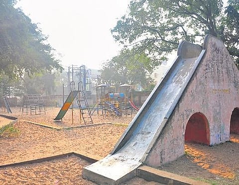 Play equipment lies idle at Gandhi Park in Guntur. (Photo | Express)