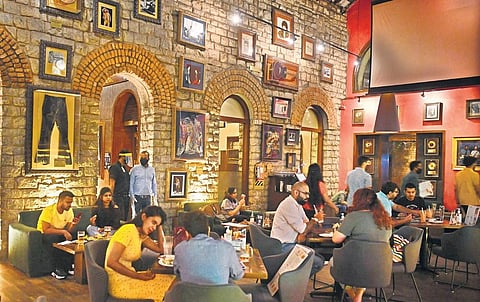 Diners at a Hard Rock Cafe. (Express Photo | Meghana Sastry)