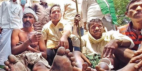 Tribals who were recently attacked by forest officials in Nagarkurnool district stage a protest outside the Telangana State Human Rights Commission (TSHRC) in Hyderabad. (Photo| EPS)