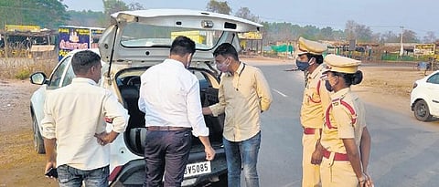 Police checking vehicles at Kaleshwaram in Bhupalpally. (Photo| EPS)