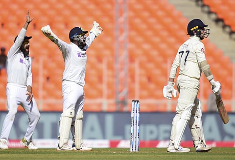 Virat Kohli with wicket-keeper Rishab Pant gestures after taking the last wicket of England batsman Jack Leach. (Photo | PTI)