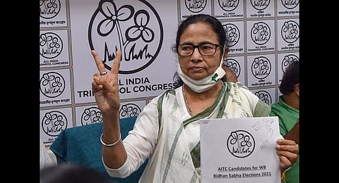 West Bengal CM and TMC Supremo Mamata Banerjee interacts with media during announcement of her party candidate list for upcoming State Assembly elections, at Kalighat in Kolkata. (Photo | PTI)