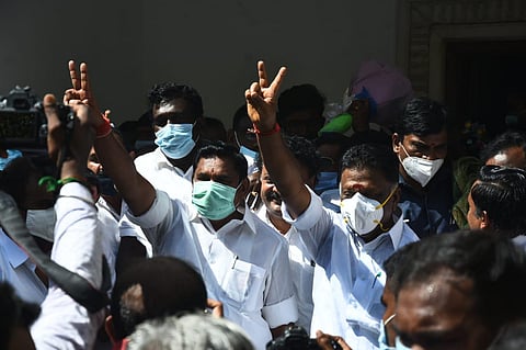 AIADMK leaders Edappadi K Palaniswami and O Panneerselvam come out of the party office after announcing the first list of candidates for the Assembly polls (Express Photo | Ashwin Prasath)