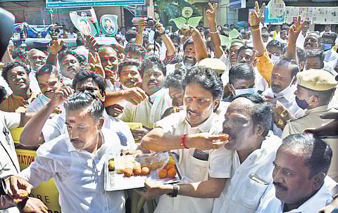 AIADMK party members distributing sweets after the party’s first candidate list was announced in Chennai on Friday | Ashwin prasath