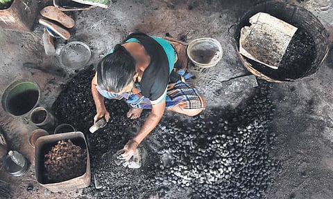 A woman worker at a cashew factory near Chirakkara in Kollam | B P Deepu