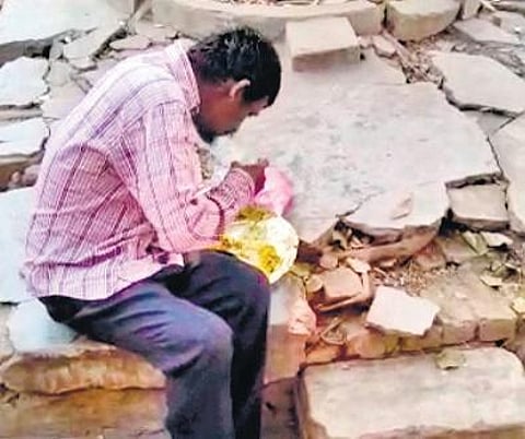 Screen grab of a man eating biryani offered by police in Rajamahendravaram.