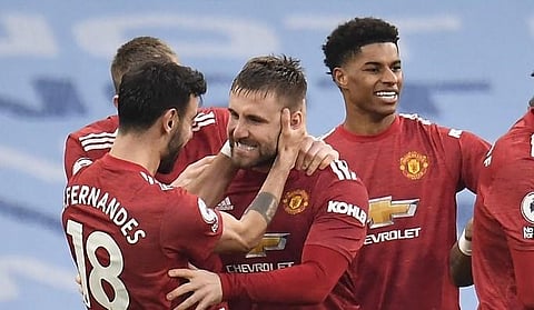 Manchester United's defender Luke Shaw (C) celebrates scoring his team's second goal againsst Manchester City at the Etihad Stadium in Manchester, north west England, on March 7, 2021. (Photo | AFP)