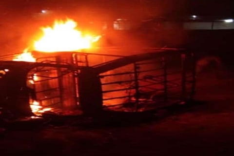 A car set ablaze in Telangana's Nirmal district.