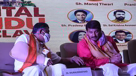 BJP National General Secretary Muralidhar Rao speaks to party’s MP Manoj Tiwari at an event at Visvesvaraya Bhavan in Hyderabad on Sunday | RVK Rao