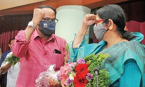Former Kozhikode district panchayat president Babu Parassery greeting his successor Kanathil Jameela (File photo) | Express