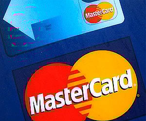 File photo of a sign for MasterCard credit cards is shown on the entrance to a bank, in New York. (Photo | AP)