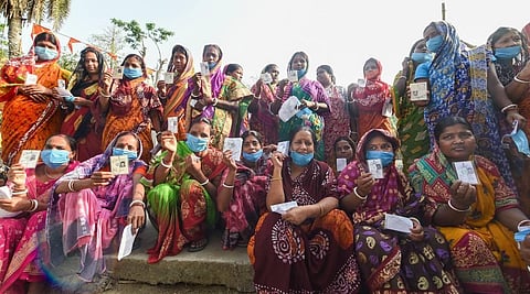 Voters show their ID cards as they arrive to cast their votes during the second phase of West Bengal Assembly polls, in Nandigram, Thursday, April 1, 2021. (Photo | PTI)