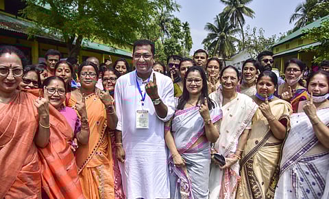 BJP Candidate Rupak Sarmah shows his finger marked with indelible ink after casting his vote at a polling station during the second phase of Assam Assembly Polls, in Nagaon. (Photo | PTI)