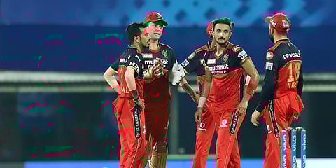 Harshal Patel of Royal Challengers Bangalore celebrates a wicket with his teammates. (Photo | ANI)