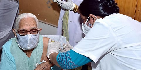 A medic administers Covid vaccine to an elderly woman, in Rajasthan's Bikaner. (Photo | ANI)