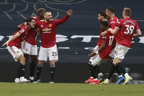 Manchester United striker Edinson Cavani celebrates with teammates their second goal during match against Tottenham at Tottenham Hotspur Stadium in London, on April 11, 2021. (Photo | AFP)