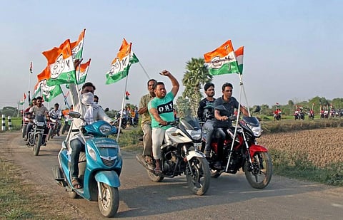Trinamool Congress supporters take out a motorcycle rally during a campaign for the West Bengal Assembly polls, at Gargaria in Birbhum district. (Photo | PTI)