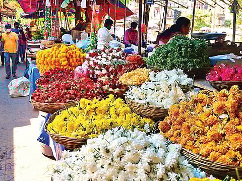 Due to the sudden spike in Covid cases, Gandhi Bazaar saw fewer people shopping for Ugadi on Monday. Flowers and fruits were on display at the market ahead of the festival | shriram bn