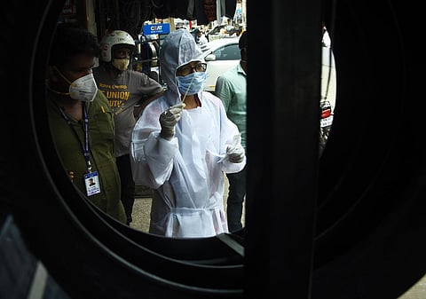 Corporation workers collecting swab samples at GP road in Chennai on Wednesday. (Photo | Ashwin Prasath, EPS)
