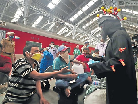 A woman personnel dressed as virus, creates awareness, at Egmore Railway Station, on Tuesday | Sri Loganathan V