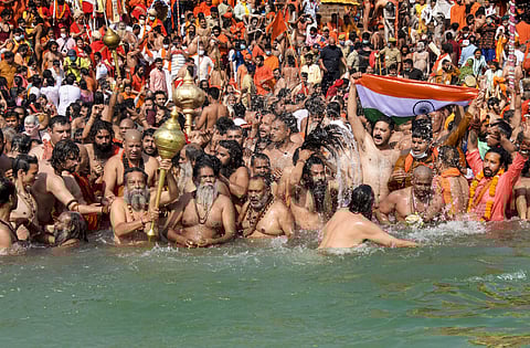 Devotees gather to offer prayers during the third 'Shahi Snan' of the Kumbh Mela 2021, at Har ki Pauri Ghat in Haridwar. (Photo | PTI)