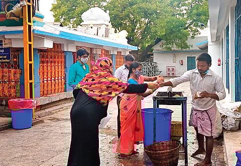 Muslim women offering coconuts before having darshan of Lord Lakshmi Venkateswara Swamy on the occasion of Ugadi in Kadapa on Tuesday. | Express