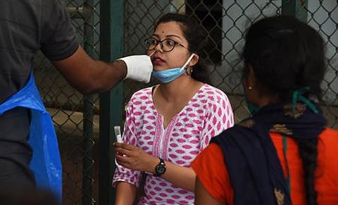 Covid test being conducted at Mysuru Road Satellite Bus Terminal in Bengaluru. (Photo | Vinod Kumar T, EPS)