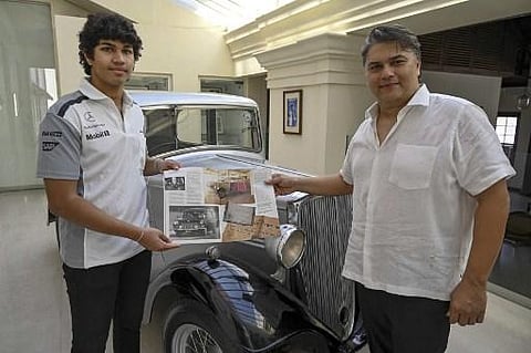 Galle Face Hotel chairman Sanjeev Gardiner (R) and his son Seshaan pose with the 1935 Standard Nine vintage car which is claimed to be owned and the first car of Prince Philip. (Photo | AFP)