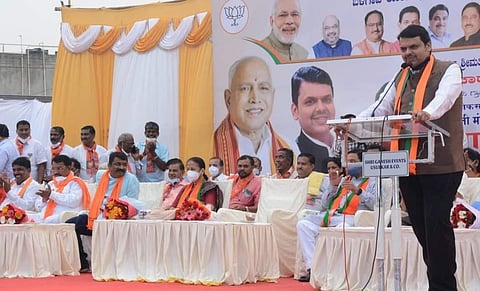 Former Maharashtra Chief Minister Devendra Fadnavis addresses people at Gokul Nagar in Hindalaga, Belagavi on Thursday | Express