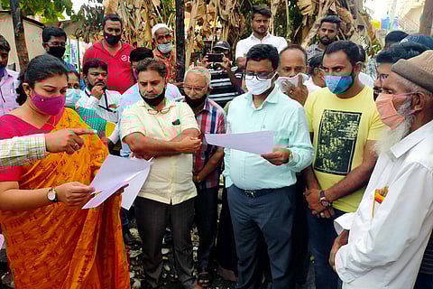 MCC commissioner Shilpa Nag and MUDA commissioner Natesh visit the site of Syed Issaq’s library in Mysuru on Monday | Express