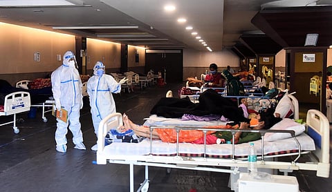 Patients are seen inside a Covid-19 care centre and isolation ward facility near a hospital in New Delhi. (Photo| Parveen Negi, EPS)