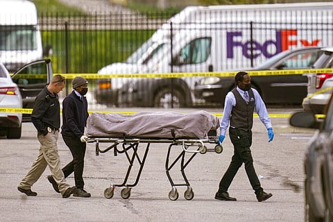 A body is taken from the scene where multiple people were shot at a FedEx Ground facility in Indianapolis. (Photo | AP)