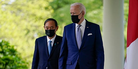 US President Joe Biden (R) with Japan PM Yoshihide Suga walks from the Oval Office to speak at a news conference. (Photo| AP)