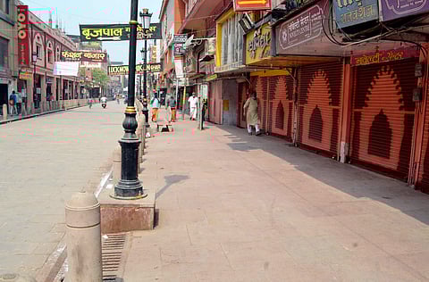 A view of the closed Varanasi shops during the weekend lockdown amid the rise in Coronavirus cases across UP. (Photo | ANI)