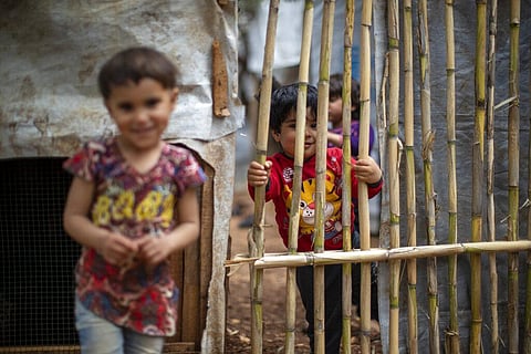 Syrian refugee children pose for a photograph at an informal refugee camp, in the town of Rihaniyye in the northern city of Tripoli, Lebanon. (Photo | AP)