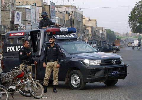 Police officers stand guard due to strikes called by the country's religious political parties over security forces's crackdown against a banned Tehreek-e-Labaik Pakistan party (File Photo | AP)