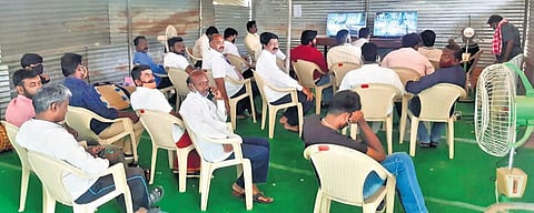 Agents for candidates from various political parties watching the CCTV videos of the strong room at GCT | Express