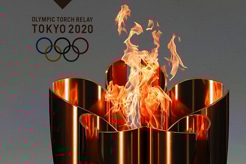 The governor of Osaka prefecture said on Thursday that he wants to cancel the Olympic torch relay legs going through Osaka later this month.(Photo | AP)
