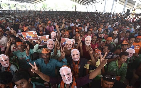 BJP supporters attend an election campaign rally of Prime Minister Narendra Modi, during the ongoing West Bengal assembly polls. (Photo | PTI)