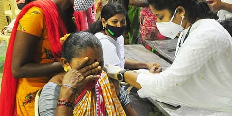 A woman get vaccinated at Swarna Bharathi Stadium in Visakhapatnam. (Photo | G Satyanarayana, EPS)