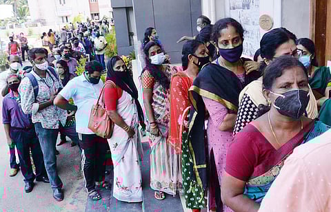 People queueing up outside Jimmy George Indoor Stadium in Thiruvananthapuram to get the token for Covid vaccination. (Photo | Vincent Pulickal, EPS)