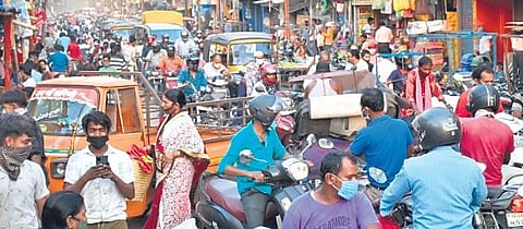 A rush of commuters and shoppers on the Main Road at Rourkela in Sundargarh district on Monday | Express