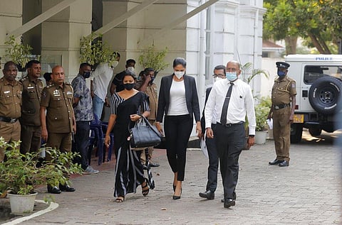Mrs. World 2019 Caroline Jurie, center, leaves a police station after obtaining bail in Colombo, Sri Lanka. (File Photo | AP)