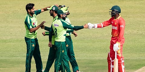 Zimbabwe's Wellington Masakadza (R) bumps fists with Pakistani players after the latter's victory at the 1st T20 match in Harare. (Photo| AFP)