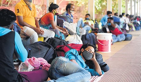 Migrant labourers at a railway station waiting. (Photo | R Satish Babu/EPS)