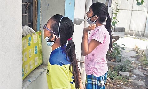 Children give swab samples for Covid-19 testing. (Photo| EPS/Parveen negi)