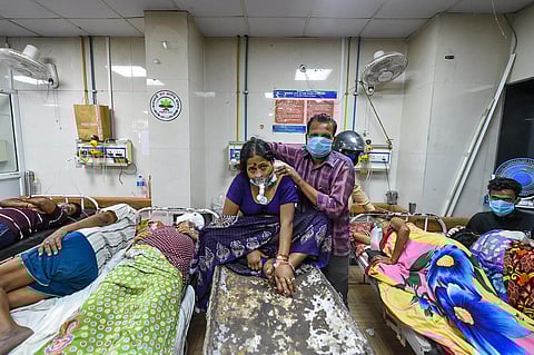 COVID-19 patients left to share beds and medical oxygen at LLR Hospital in Kanpur, amid a shortage in supplies due to surging coronavirus cases across the country. (Photo | PTI)