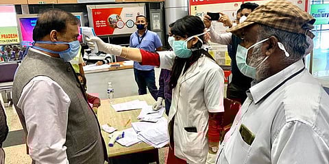 An official uses thermal screening device on Assam Health Minister Himanta Biswa Sarma in the wake of coronavirus pandemic on his arrival at Dibrugarh Airport. (Photo| PTI)